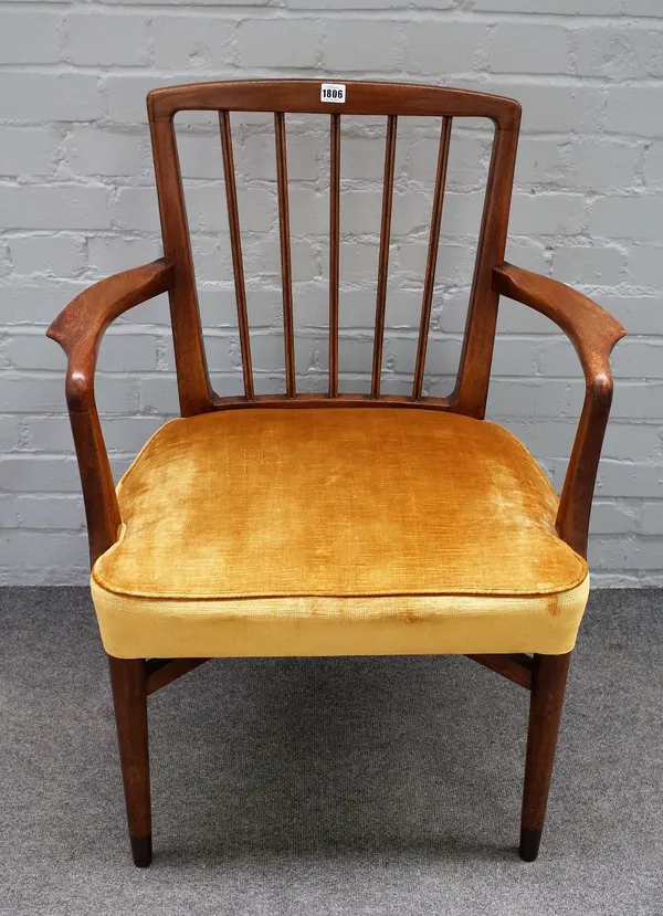 Probably Danish; a mid-20th century teak open armchair on metal capped turned supports, 66cm wide x 91cm high.