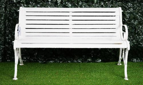 Possibly Coalbrookdale, a white painted cast iron garden bench on X-framed ends, with diamond registration mark to back, 137cm wide x 81cm high.