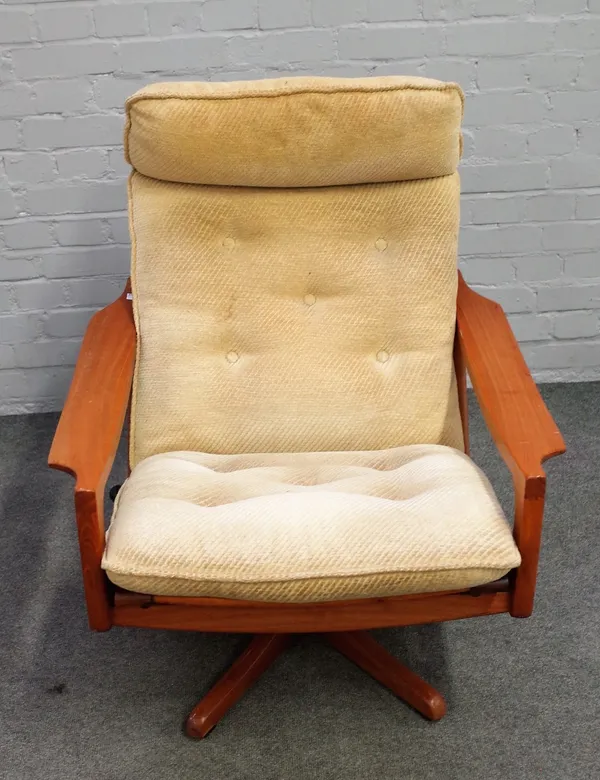 Mid-20th century design; a teak framed reclining and revolving easy open armchair on five point base, 76cm wide x 86cm high.