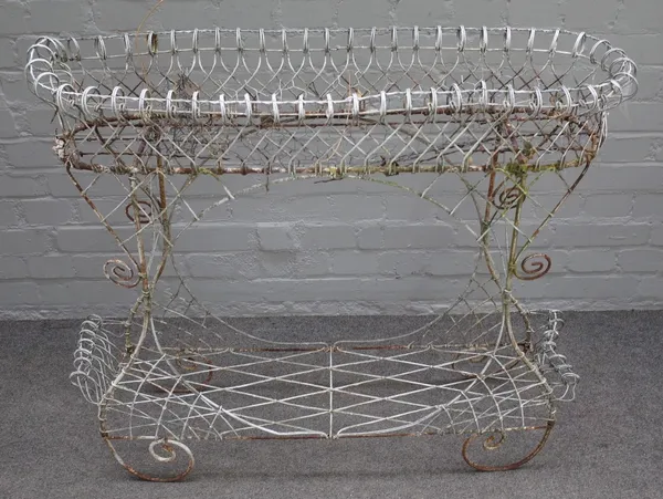 An Edwardian white painted wirework oval two tier plant stand, 95cm wide x 87cm high.