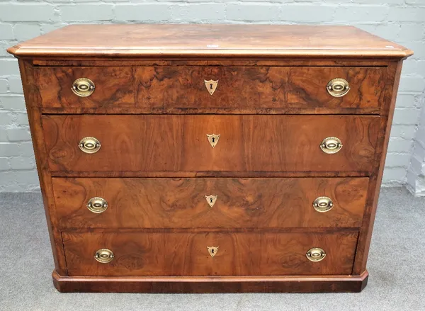 An early 19th century Continental figured walnut chest of four long graduated drawers, 113cm wide x 84cm high.