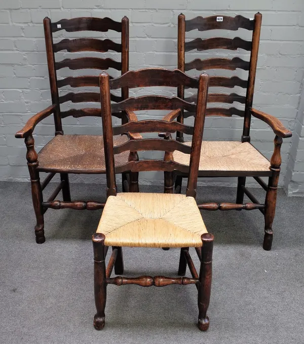 A matched set of eight 18th century ash rush seated ladderback dining chairs, to include a pair of carvers (8).