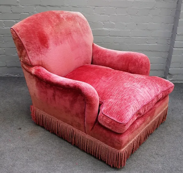 Howard and Sons, a later pink upholstered easy armchair on turned mahogany supports, 80cm wide x 85cm high.