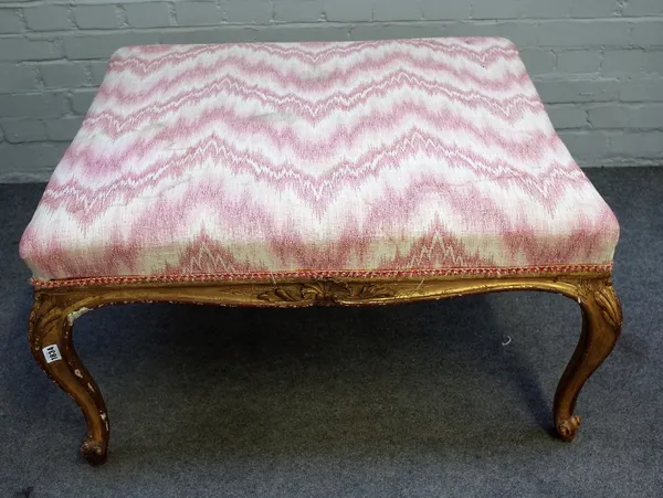 A Louis XV style gilt framed rectangular footstool of serpentine outline, on scroll supports, 88cm wide x 50cm high.