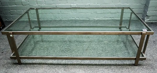 A 20th century polished chrome and glass rectangular two tier coffee table, 130cm wide x 37cm high.