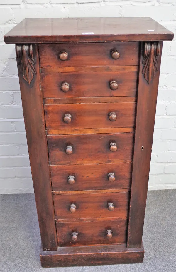 A Victorian mahogany Wellington chest, with seven long graduated drawersn enclosed by a locking bar, 48cm wide x 103cm high.