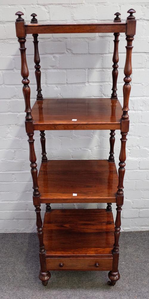 A Victorian rosewood four tier whatnot with single drawer base, on turned supports, 42cm wide x 141cm high.