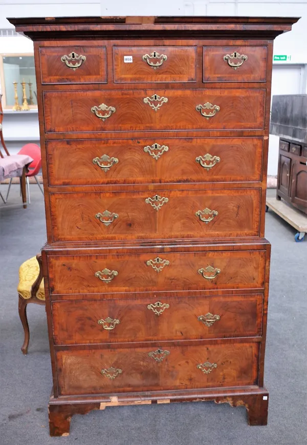 A George III feather and cross-banded walnut chest on chest with three short over six long graduated drawers, on bracket feet, 109cm wide x 178cm high