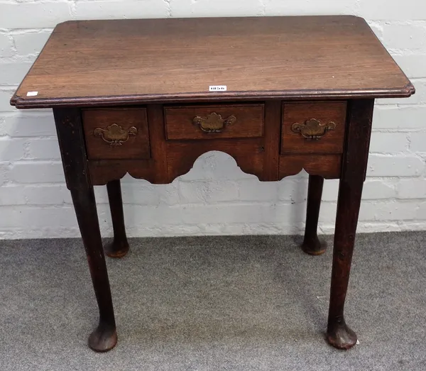 An 18th century oak lowboy, with three frieze drawers on club supports, 76cm wide x 70cm high.