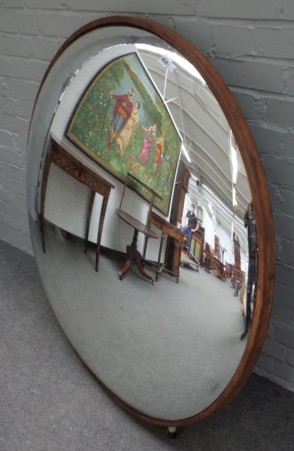 A large modern convex circular wall mirror, with metal band frame, 118cm diameter.