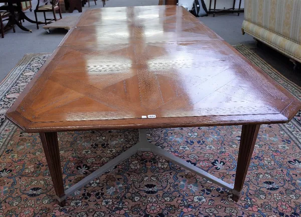 Roche Bobois a 19th century French style extending dining table, the parquetry oak top on tapering channelled square supports, united by 'X' frame str