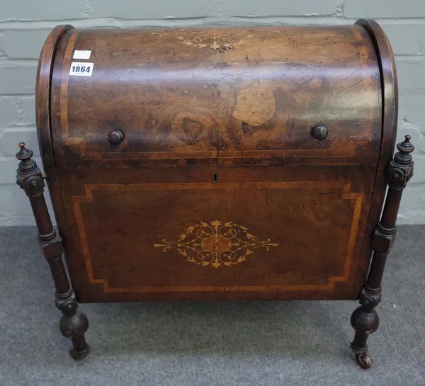 A Victorian walnut crossbanded and foliate inlaid Canterbury, the hinged domed top enclosing three divisions, with outset turned supports, 55cm wide x