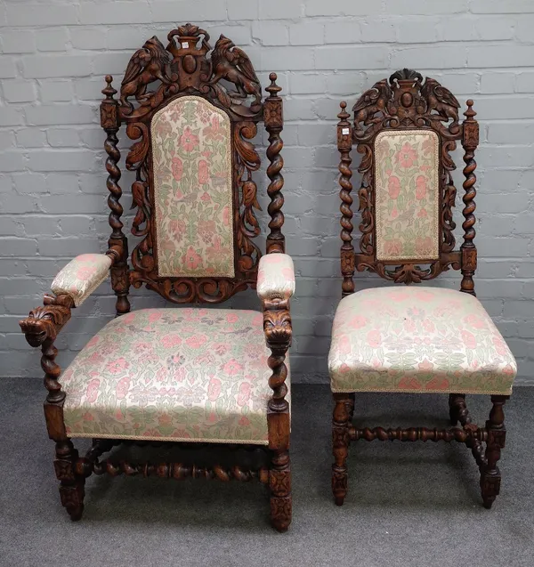 A set of seven late 19th century carved oak dining chairs on barleytwist supports, to include a pair of carvers (7).