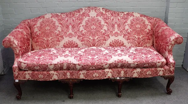 Baker Furniture; a George I style humpback sofa on eight mahogany scroll supports, 215cm wide x 100cm high.