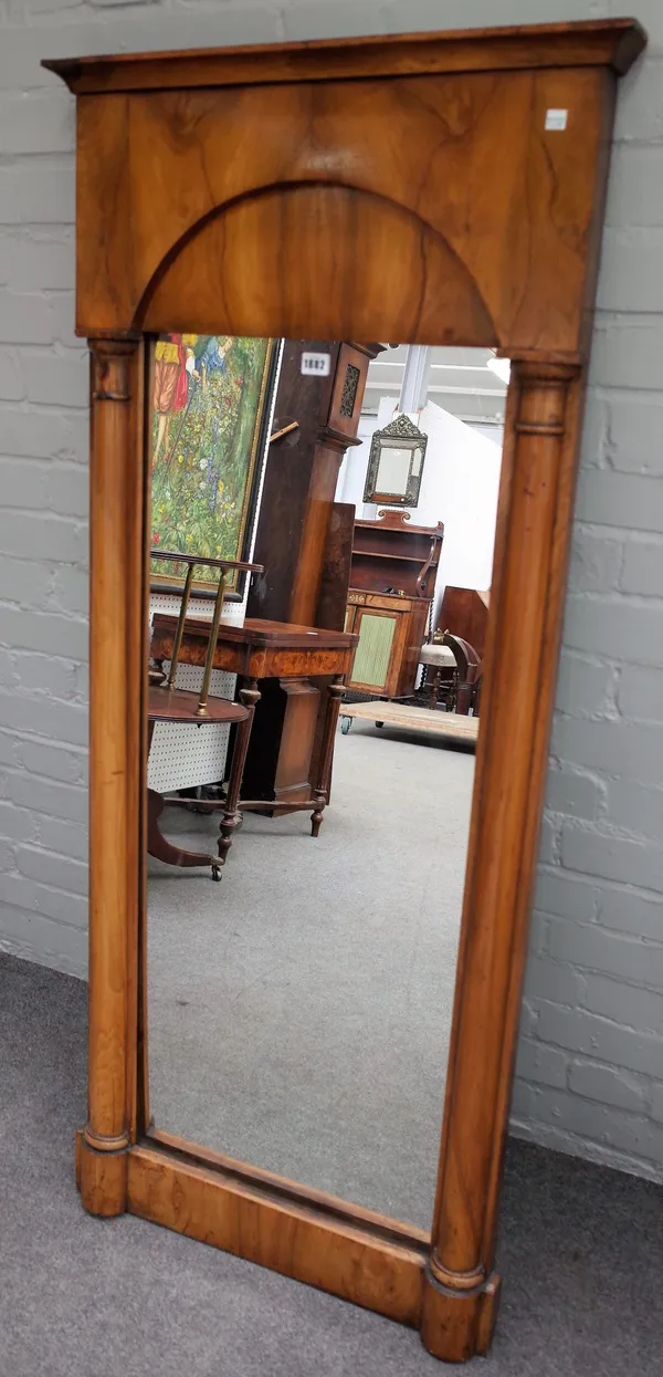 An early 19th century Biedermeier fruitwood rectangular mirror, with split turned column mounts, 66cm wide x 150cm high.