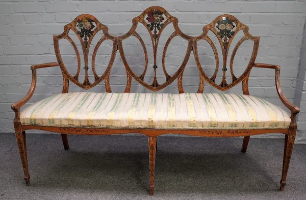 A 19th century floral polychrome painted satinwood triple back sofa, on tapering square supports, 151xm wide x 102cm high.