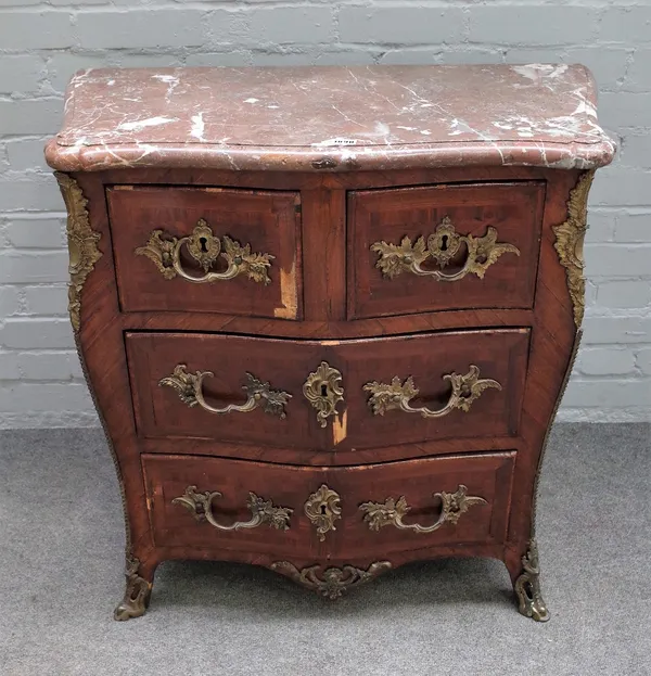 An 18th century French gilt metal mounted Kingwood commode, the marble top over a serpentine base, with two short and two long graduated drawers on sp