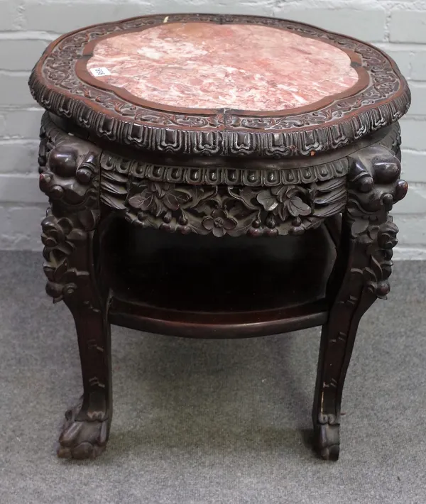 A late 19th century Chinese hardwood jardiniere stand, the marble inset circular top on carved supports united by platform undertier, 65cm wide x 58cm