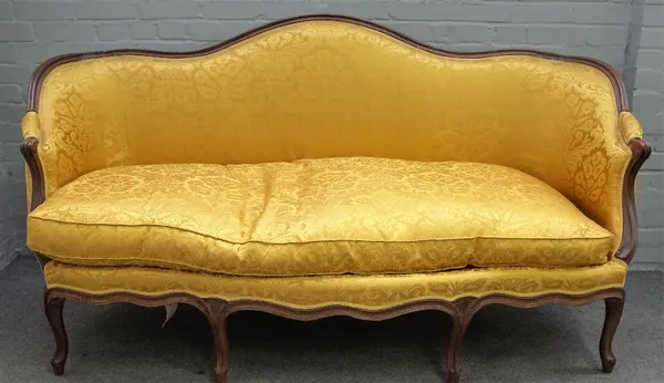 A Louis XV style tub back sofa the shape back over serpentine seat on eight shaped supports, 185cm wide x 101cm high.