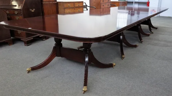 A George III style mahogany four pillar extending dining table, on sixteen downswept supports, 154cm wide x 488cm long.