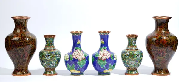 Three pairs of Chinese cloisonné vases, 20th century, the first pair worked with peony and a bird against a blue ground, 23cm. high; the second pair w