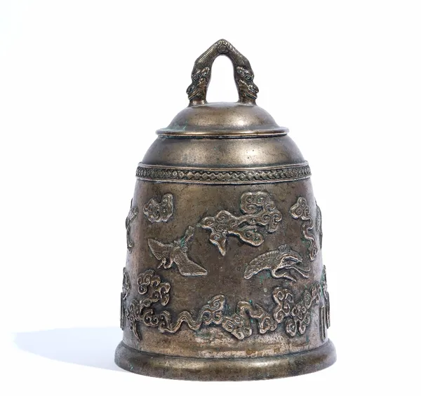 A Chinese bronze bell, 19th/20th century, the sides cast in high relief with cranes flying amongst clouds, cast signature, 28cm. high.