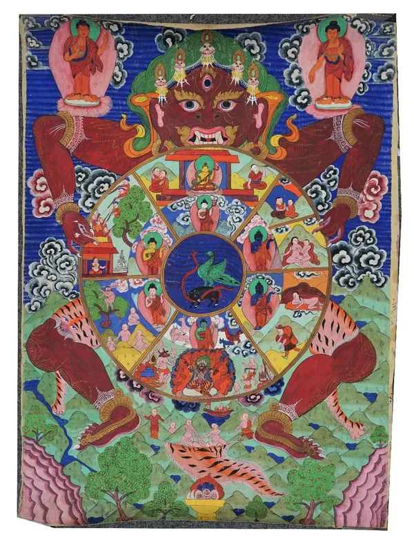 A large Tibetan thangka, probably late 19th century, opaque pigments on cloth, painted with Yama, the Lord of Death, holding the Wheel of Life, the ce