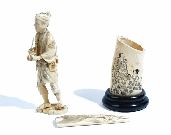 A Japanese sectional ivory okimono of a man, Meiji period, carved standing holding a fruit and knife, signed, (a.f), 19.5cm. high; also a Japanese ivo