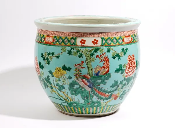 A Chinese turquoise- ground jardiniere, early 20th century, painted with two pheasants amongst flowering peony, 34cm. high by 39cm. diameter.