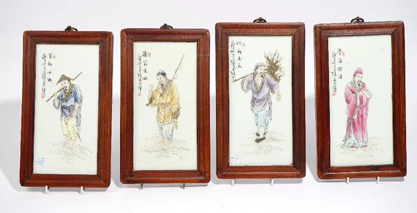 A set of four Chinese famille-rose rectangular plaques, 20th century, each painted with a single figure beside script, 24 cm. by 11.5cm., framed, (4).