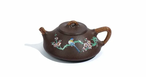 A Chinese yixing teapot and cover, 20th century, the squat body enamelled with a bird perched in branches of flowering prunus blossom, stamped marks,