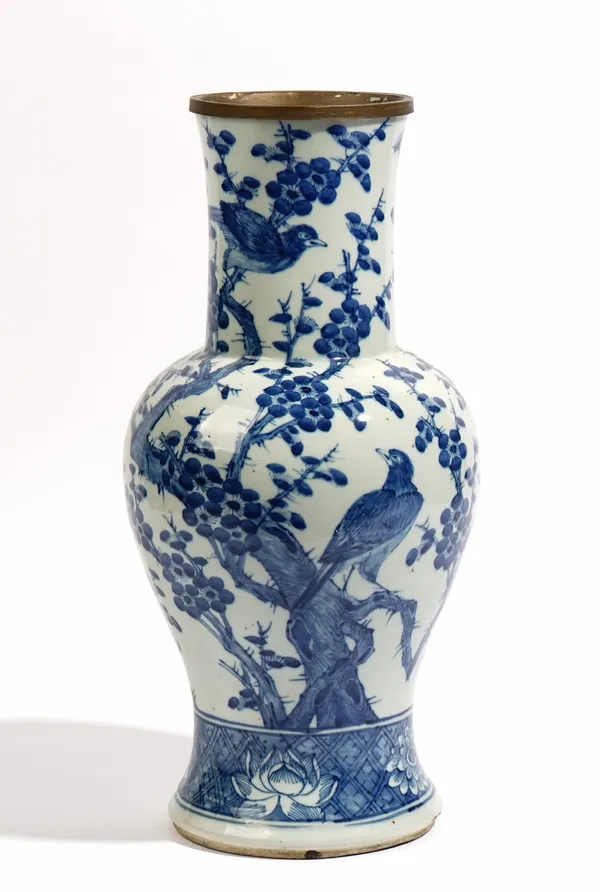 A Chinese blue and white baluster vase, 18th century, each side painted with two birds amongst branches of flowering peony, above a diaper border pain