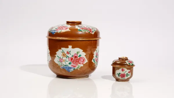 A Chinese famille- rose café au lait ground deep bowl and cover, 18th/19th century,  each piece decorated with leaf shaped panels enclosing peonies an