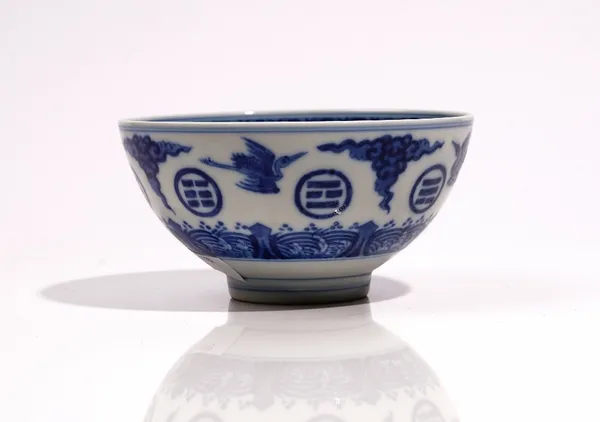 A Chinese blue and white `trigrams' bowl, blue Daoguang seal mark but probably later, painted with cranes in flight alternating the the eight trigrams