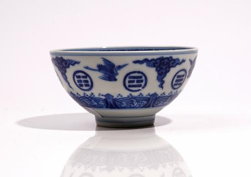 A Chinese blue and white `trigrams' bowl, blue Daoguang seal mark but probably later, painted with cranes in flight alternating the the eight trigrams