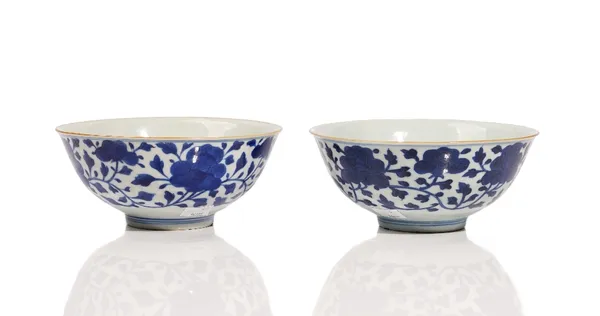 Two Chinese blue and white bowls, blue Jiaqing seal marks but possibly later, each painted to the exterior with blossoming peony, 17.25cm. and 17.5cm.