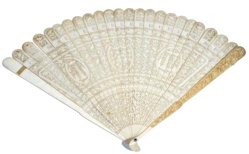 A Chinese ivory brisé fan, 19th century, carved and pierced with pagodas, birds and flowers, the guard sticks carved with birds amongst flowering bran