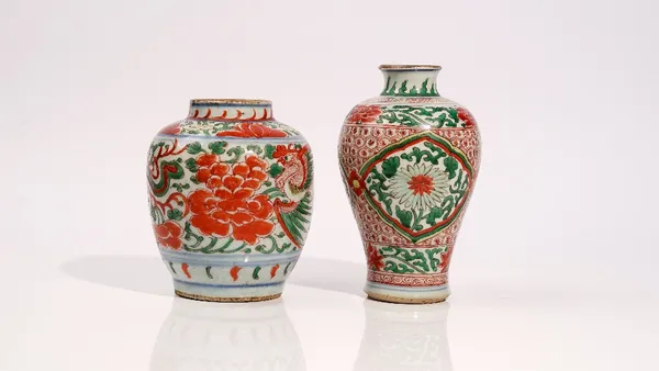 A Chinese wucai ovoid vase, 17th century, painted in typical palette with two pheasants amongst peonies, 16.5 cm. high; and another wucai baluster vas