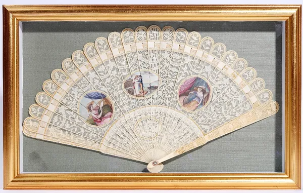 A Canton ivory brisé fan, circa 1800, painted probably in Europe with a vignette of a sailor and his lass flanked by two vignettes of young women, the