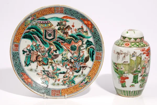 A Chinese famille-verte dish, circa 1900, painted with warriors in a procession, 29cm. diameter; and a famiile-verte slender ovoid vase and a cover, p