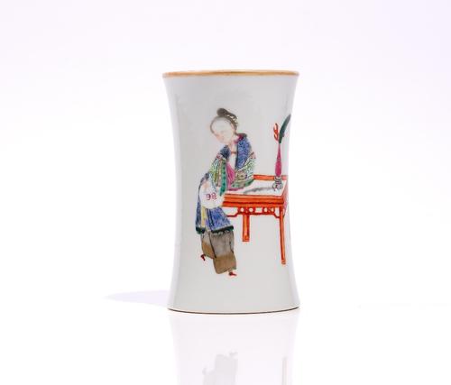A Chinese famille-rose brushpot, Daoguang seal mark but later, of slender waisted form, painted with a young woman at a table, 12.5cm. high.