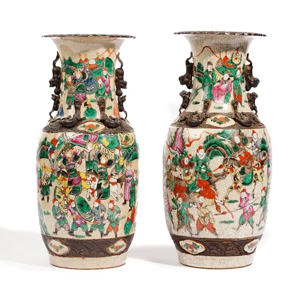 A pair of Chinese crackle glazed baluster vases, late 19th century, painted with battle scenes, 35cm. high, (2).