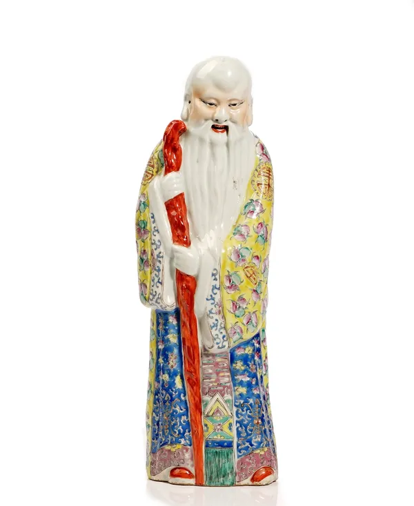 A tall Chinese famille-rose porcelain figure of Shoulao, 20th century, modelled standing in long robes with a staff, unmarked, 48cm. high.