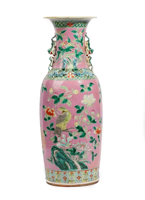 A tall Chinese famille-rose pink ground vase, late 19th century, painted each side with a bird amongst flowering branches, 61cm. high.