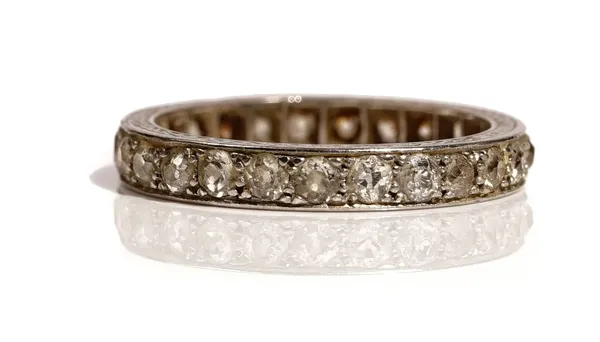 A platinum and diamond set full eternity ring, mounted with cushion shaped diamonds, the sides of the mount with engraved decoration, detailed PLAT, r