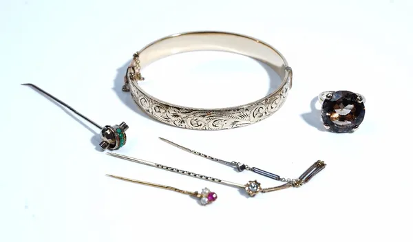 A Victorian gold and diamond set single stone stick pin, mounted with a cushion shaped diamond, fitted to a bar link chain, with a further small stick