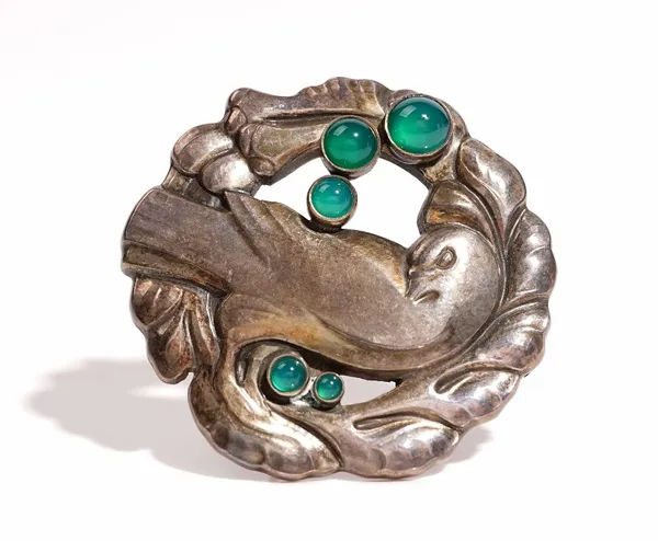 A Georg Jensen silver and green stained agate brooch, designed as a bird within a foliate openwork surround, mounted with five green stained agate bea