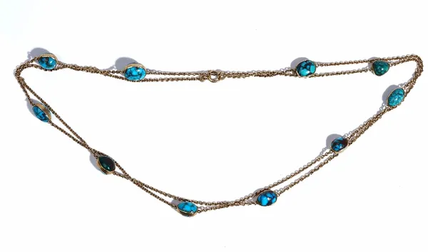 A gold and turquosie matrix long chain, the oval link chain spaced with collet set turquoise matrix at intervals, on a boltring clasp, detailed indist