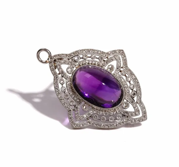 A diamond and amethyst pendant brooch, in a pierced shaped oval quatrefoil design, mounted with the oval cabochon amethyst to the centre and otherwise