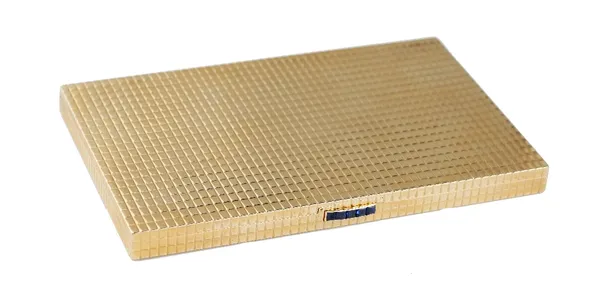 A Cartier gold rectangular cigarette case, the exterior with a patterned decoration and with a calibre cut sapphire set five stone thumbpiece, detaile